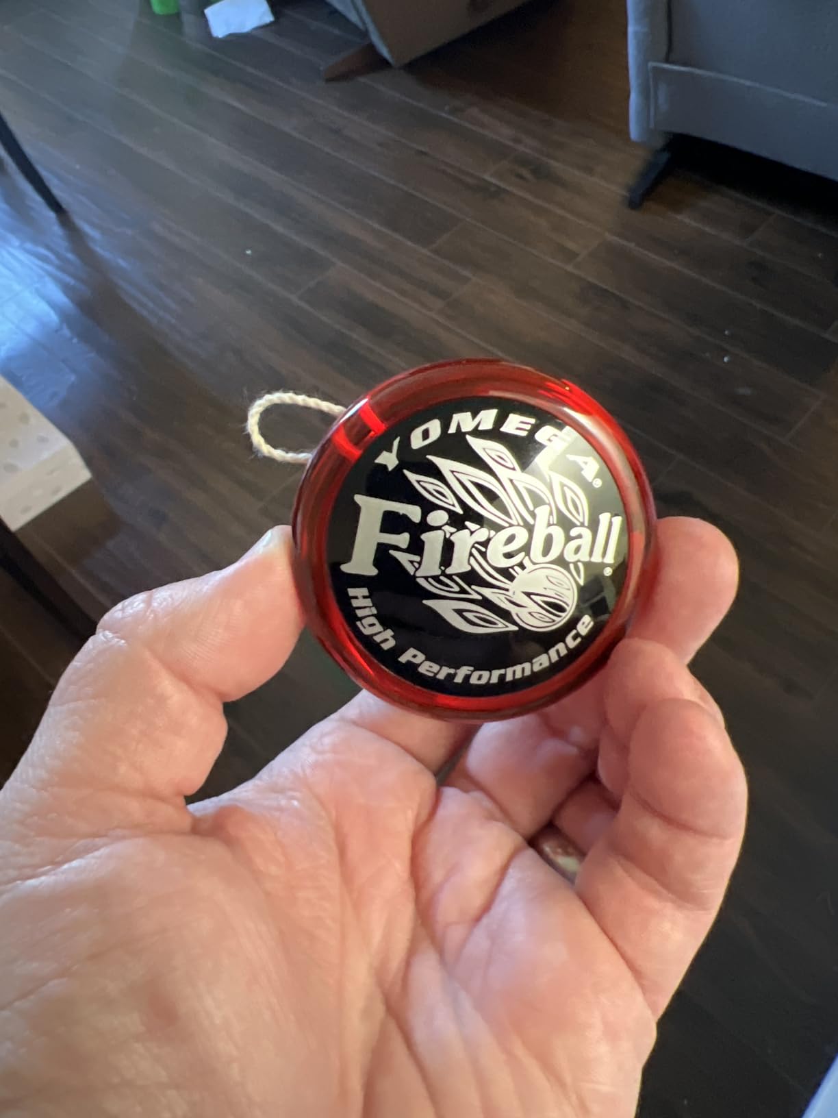 Customer holding a red and black Yomega Fireball yo-yo