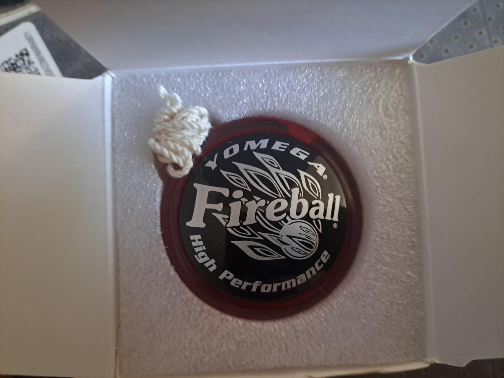 Yomega Fireball yo-yo with its string, unboxed by a customer