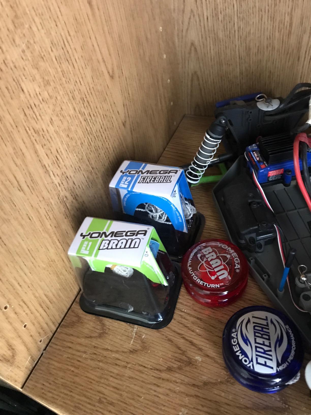 Yomega Brain and Fireball yo-yos in their packaging on a shelf