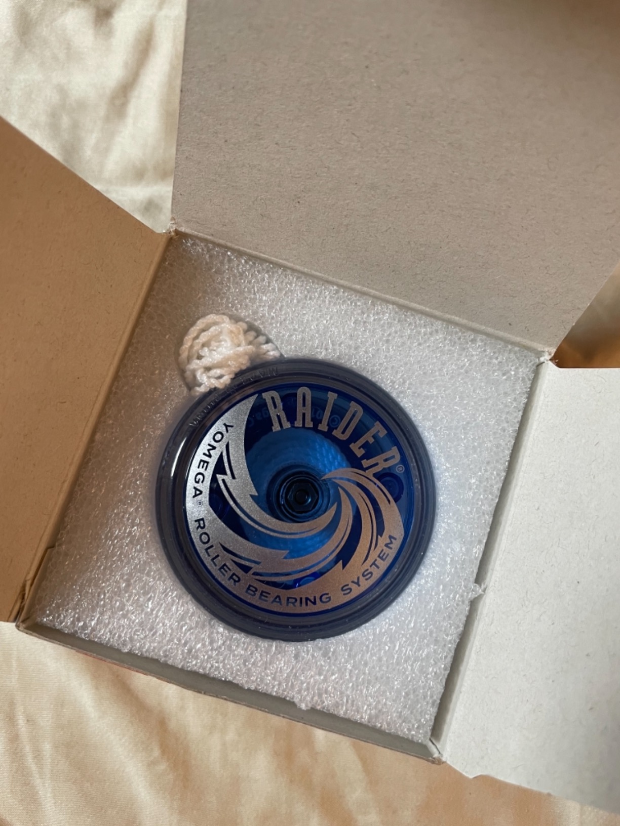 Yomega Raider ball-bearing yo-yo in blue and black, still in its box